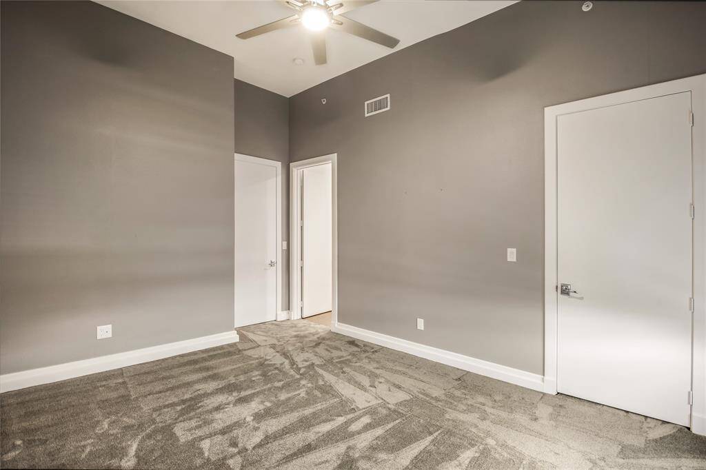 The utility room has hanging rods that you can pull down if needed. Cabinets for storage and a sink!