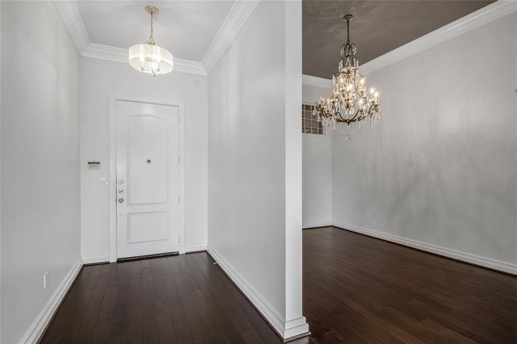 The floors are amazing! To the immediate left is a secondary bedroom with a full bathroom next to it.