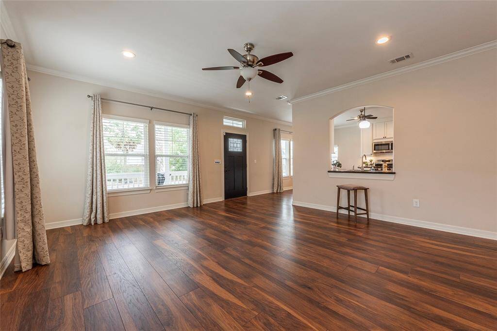 Filling the space with natural light and easy access to the kitchen and dining area, allows for the perfect space for entertaining and everyday living