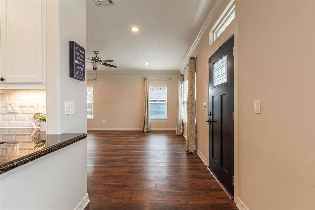 View from the dining/kitchen area looking into the living room/entry way