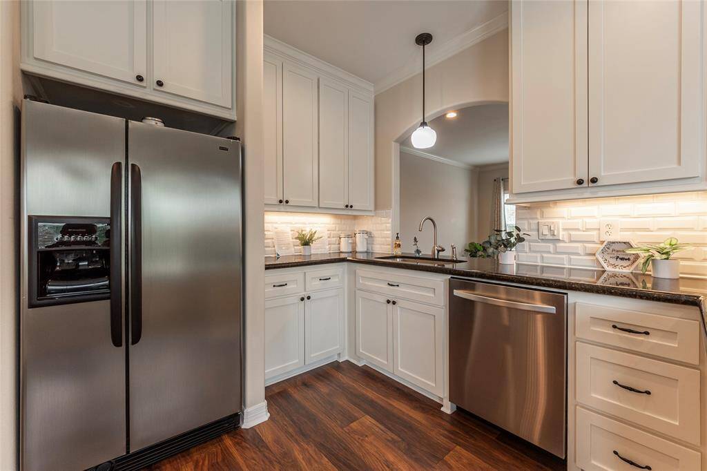 Custom built ceiling-height cabinets allow for plenty of storage