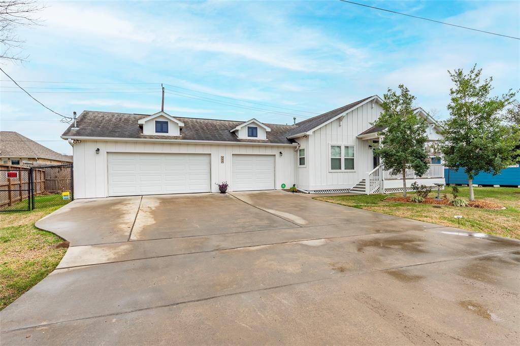 Charming coastal cottage with custom craftsmanship, nestled in a serene lakeside community. Spacious 8,000 sq. ft. lot