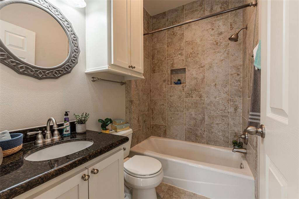 Stylish and functional, featuring a tub/shower combo with beautiful porcelain tile.