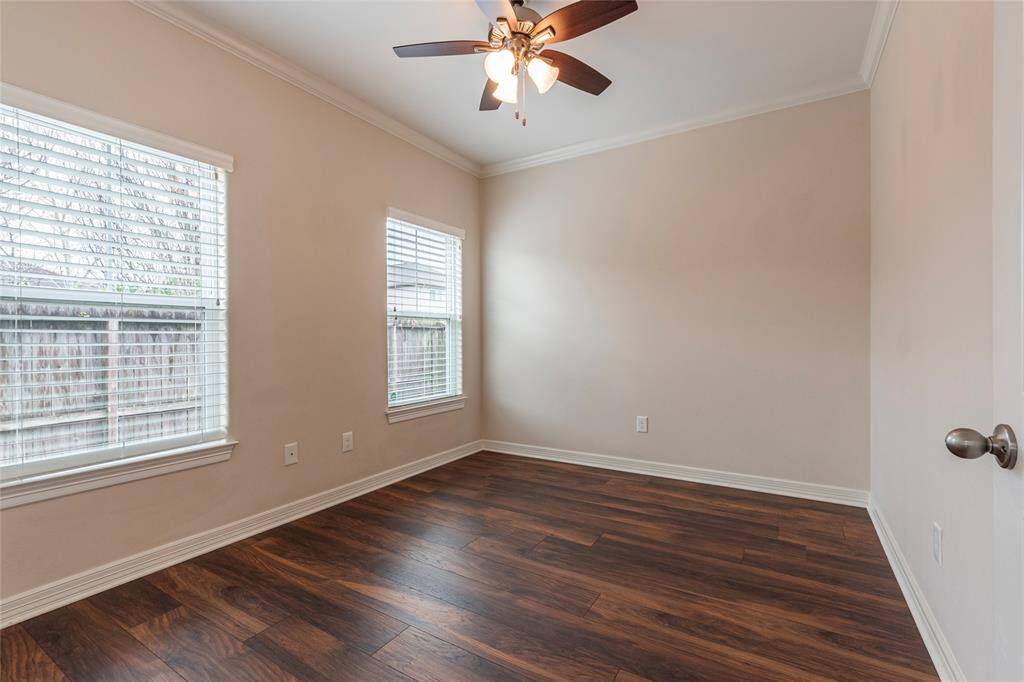 This spacious secondary bedroom offers comfort and versatility, perfect for family, guests, or a home office