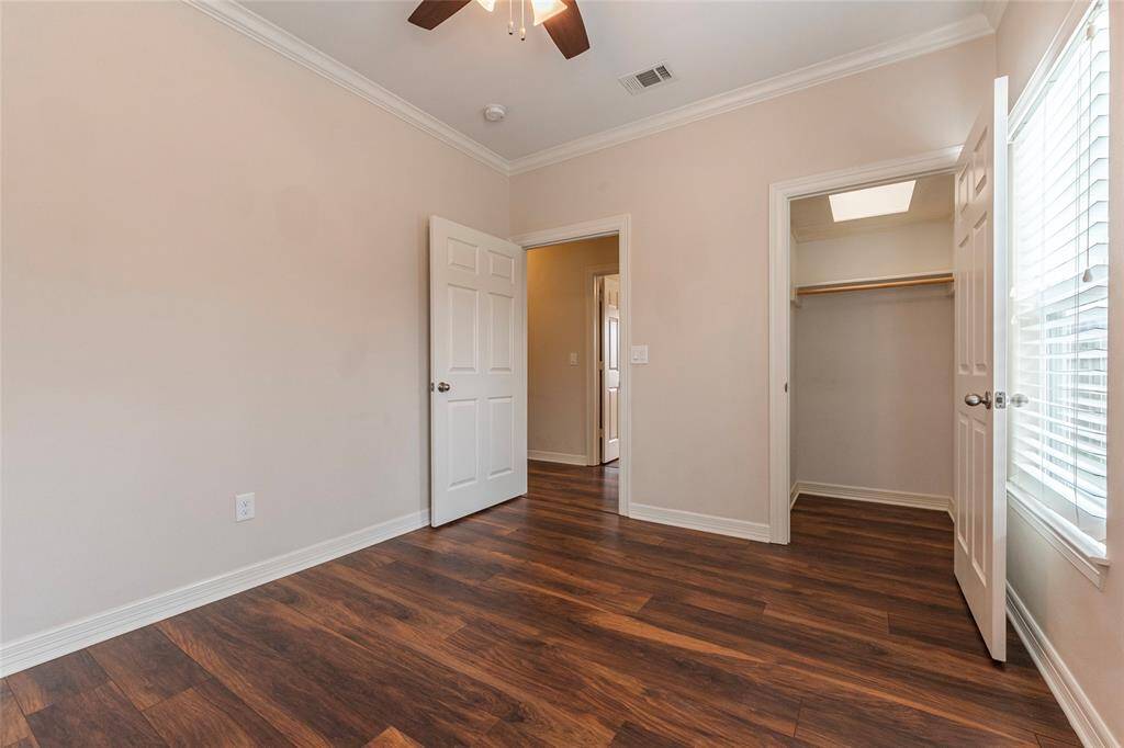Secondary bedroom closet with addtional loft style storage in closet