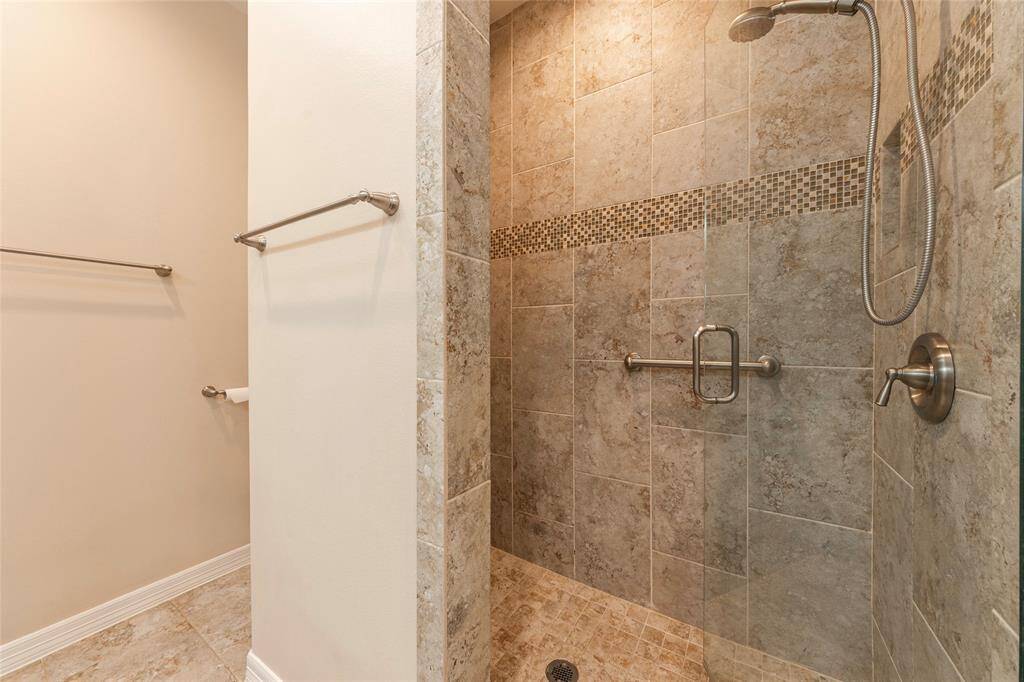 Primary ensuite features a porcelain tiled walk in shower