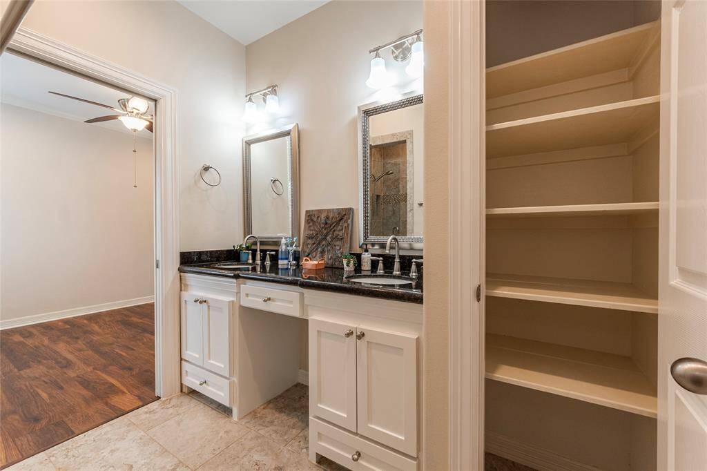 This stylish ensuite offers ample storage and counter space, making your morning routine a breeze. With sleek finishes and thoughtful design, it combines elegance and functionality for a perfectly organized bathroom.