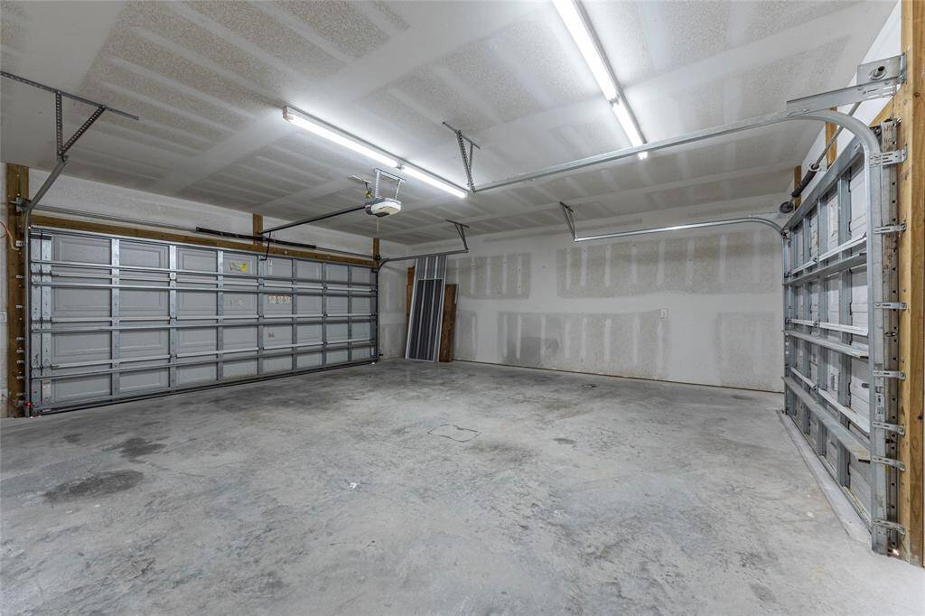 2 car garage with double sided garage door allowing access to backyard - 750 square feet of garage space makes this space a perfect place for all of the outdoor toys and plenty of storage