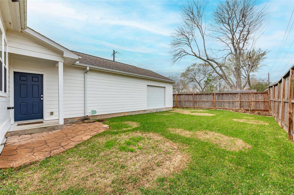 Fully fenced backyard, offering privacy and plenty of space for outdoor entertaining, gardening, or pets.