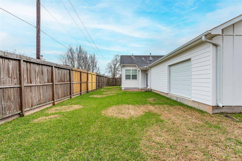 Access the garage from the backyard using the double sided garage door