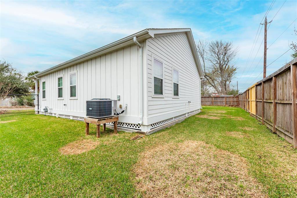 The spacious backyard is perfect for entertaining, with plenty of room for gatherings