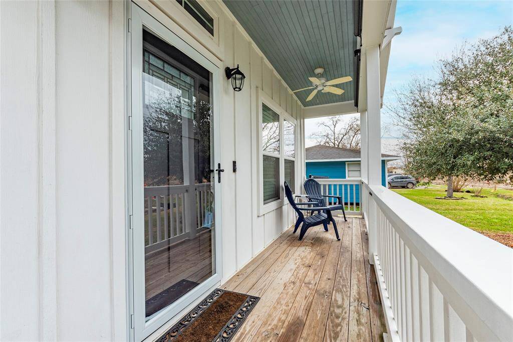 Imagine spending time on this welcoming front porch with sun shades