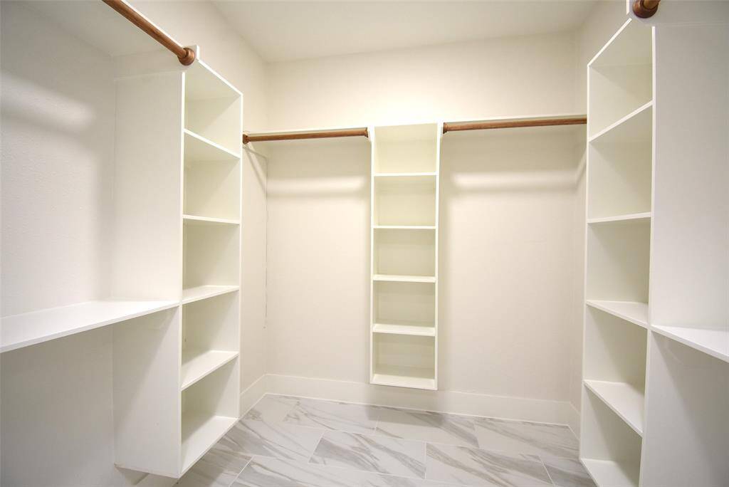 Huge walk-in closet with shelves, spacious!