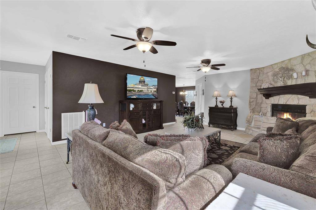 Spacious living area with gas stone fireplace