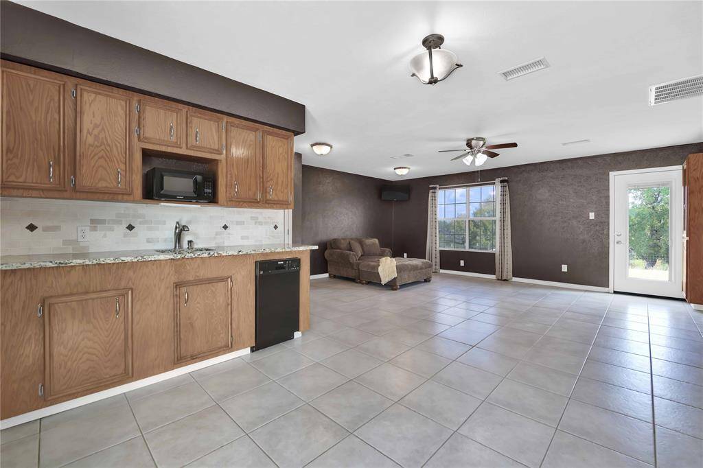 Guest suite has access to the backyard with expansive views