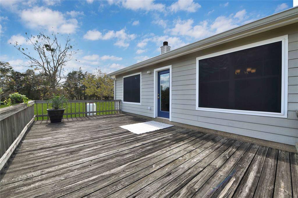 Deck in photo was removed and currently has a new single set of stairs from door down to ground.