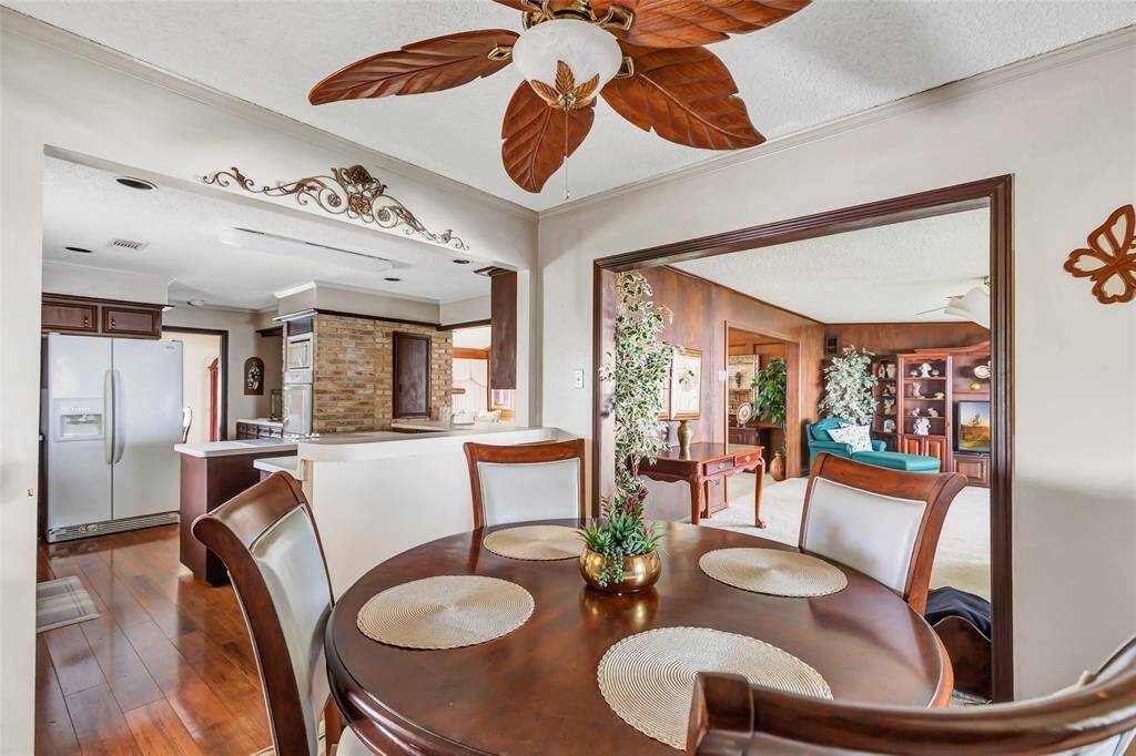 View of breakfast into kitchen to the left and den/sitting area...