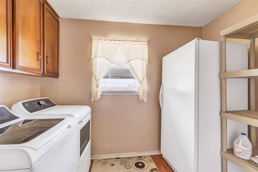 Utility room is large enough for a freezer & extra storage...