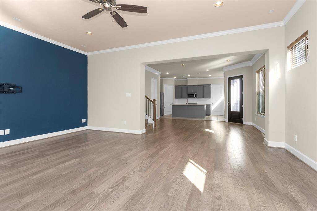 Note the stylish accent wall present in the living space.