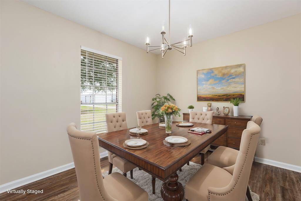 Elegant dining room with brand-new flooring.
