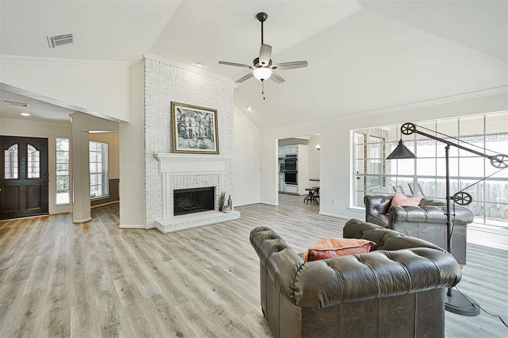 This cozy home has an incredible layout. Everything flows together and has a special and unique place. This charming fireplace was finished in German schmear technique and is lit with a separate ceiling light.