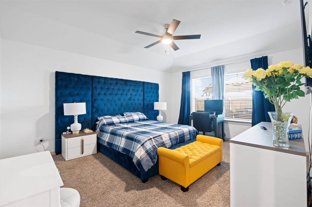 This Primary Bedroom is equipped with a ceiling fan, a comfortable workspace area, and is very well-lit. Approximate Measurements:16X12