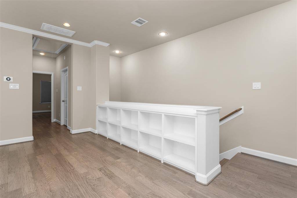 The upstairs landing features these built ins for decorations, books, or extra storage.