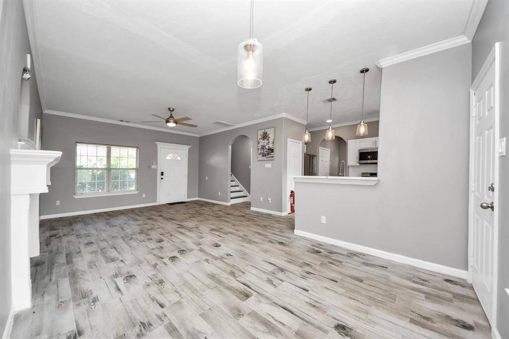 Modern open-concept dining area is open to the kitchen and living room.