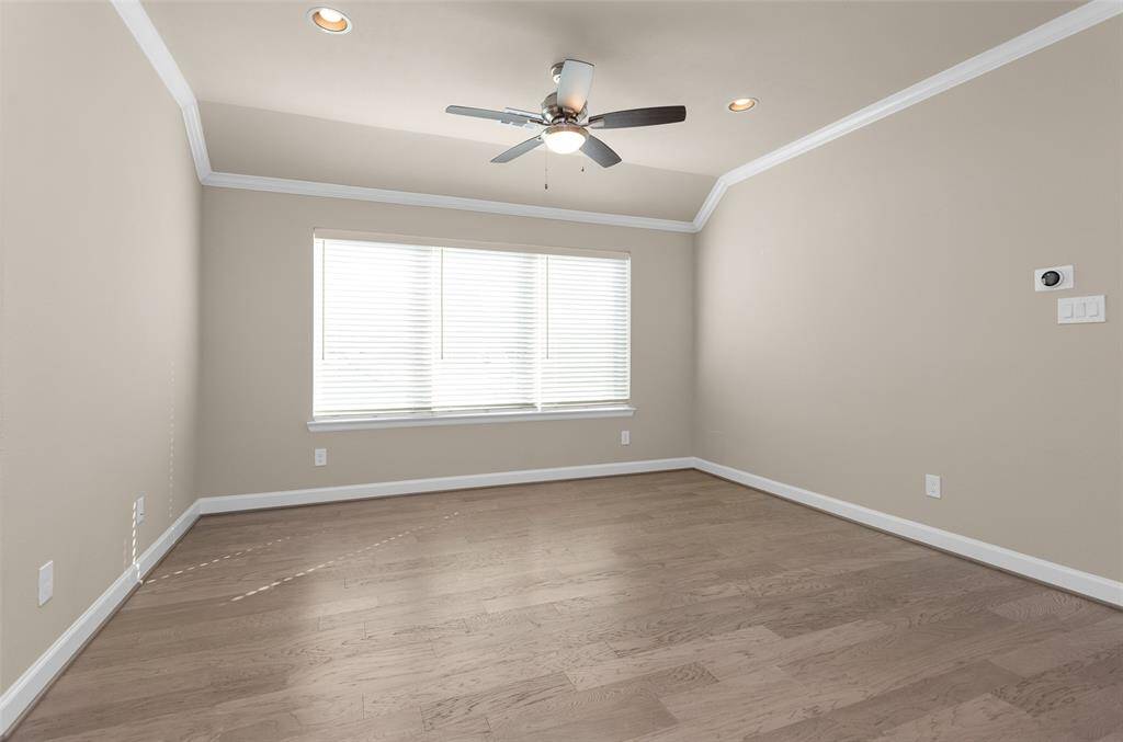 The upstairs landing opens up to a game room/flex space.