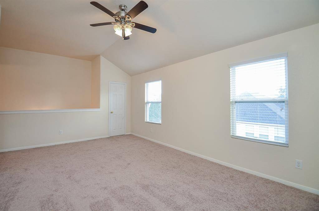This is the huge carpeted 2nd level 'game room', with lots of room for true gaming gear and/or a second living/family space.