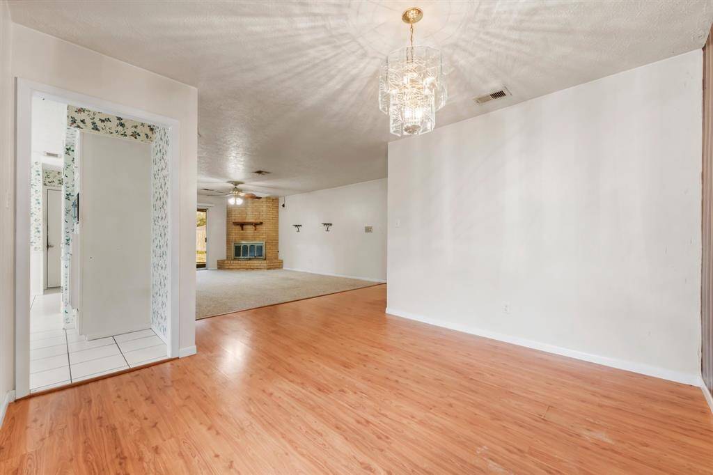 The cozy eat-in breakfast area features a convenient door that leads directly to the garage, adding functionality to this charming space.