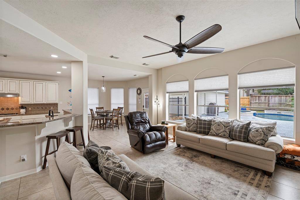 Family living space with gorgeous views of backyard pool.