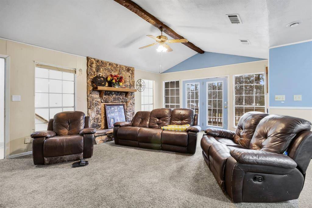 A versatile space currently a second living room. Perfect for a media room, playroom, or additional lounge area, connecting seamlessly with the home’s layout.
