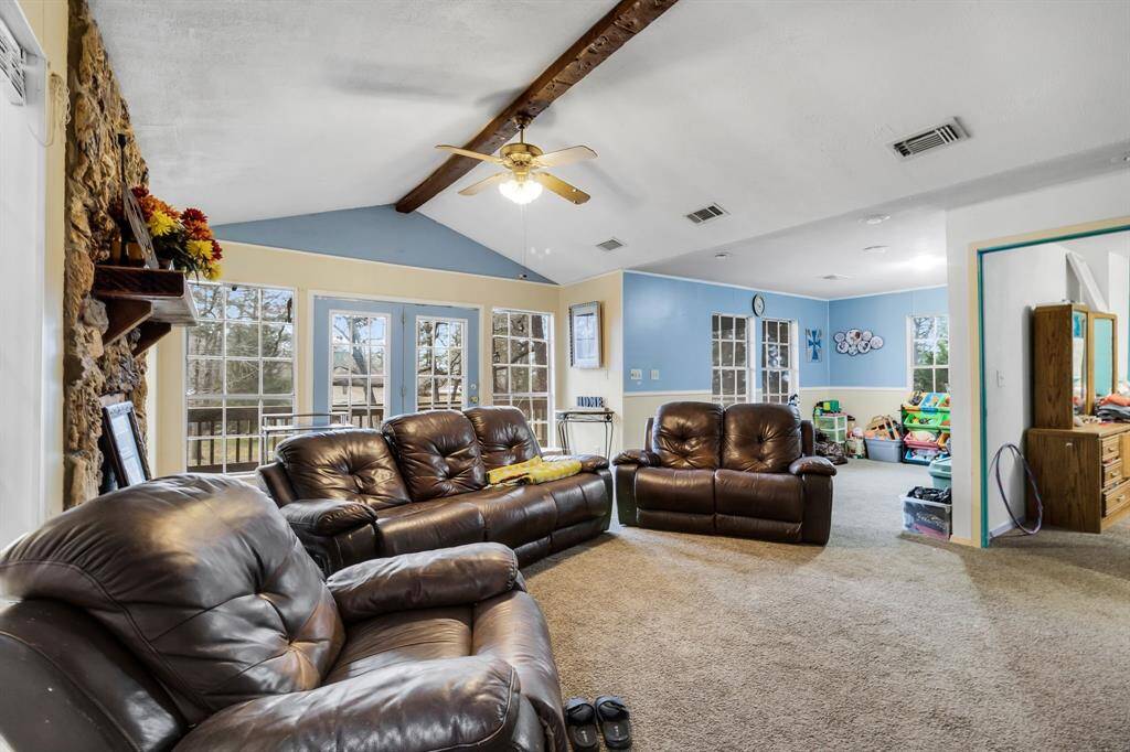 A versatile space currently a second living room. Perfect for a media room, playroom, or additional lounge area, connecting seamlessly with the home’s layout.