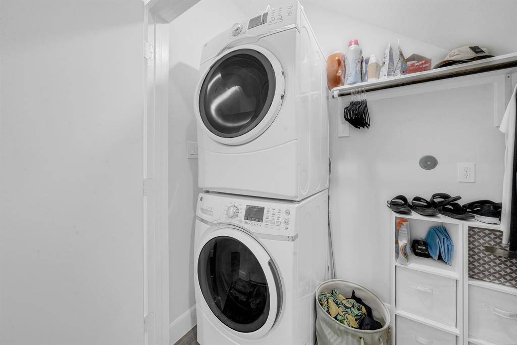 Utility room for full size stackable washer and dryer.