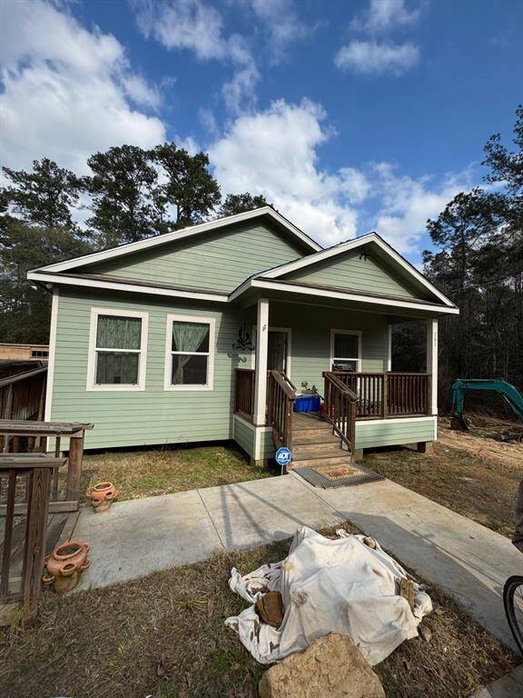 Front of home with covered porch.