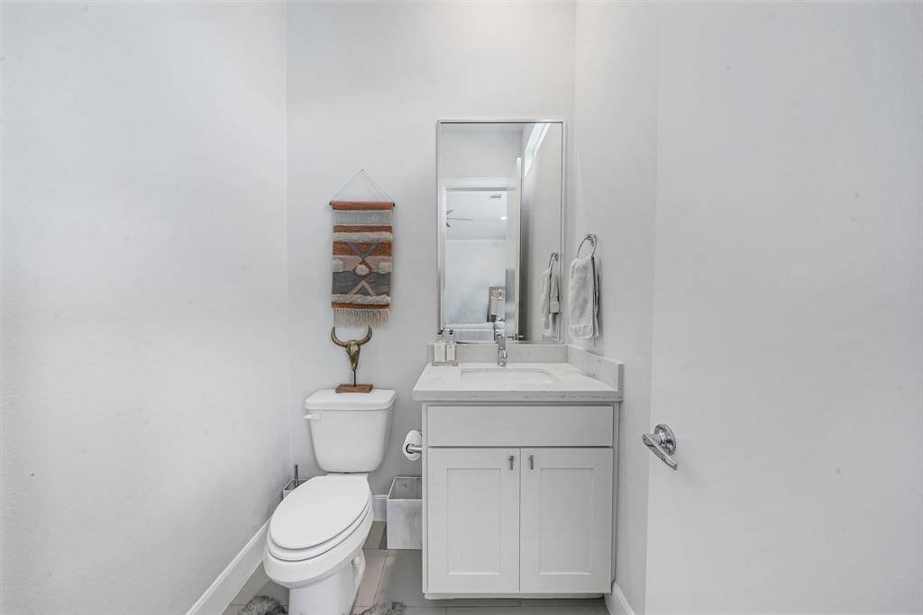 Powder room off of living area 2nd floor.