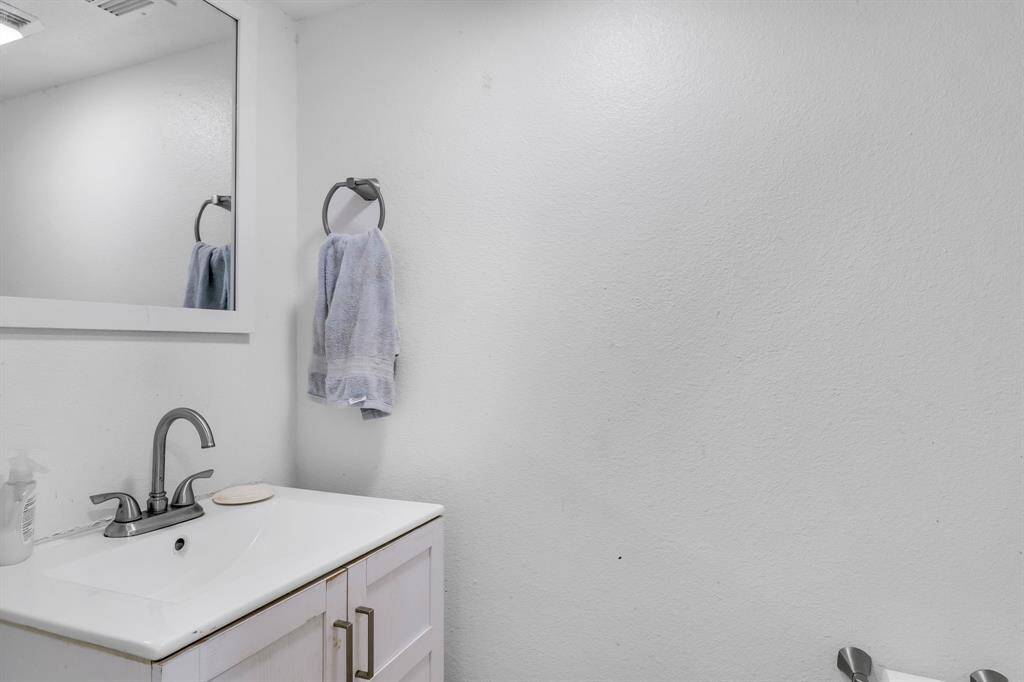Updated half bathroom with modern fixtures.