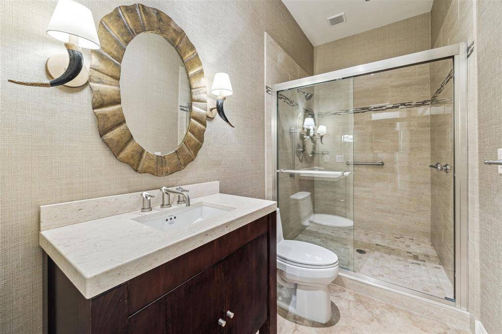 The second full bathroom down has an easy accessible, large shower