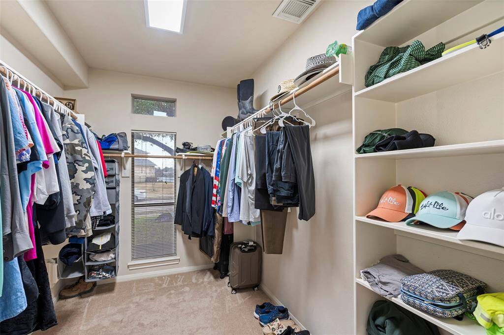 Primary bedroom walk-in closet.