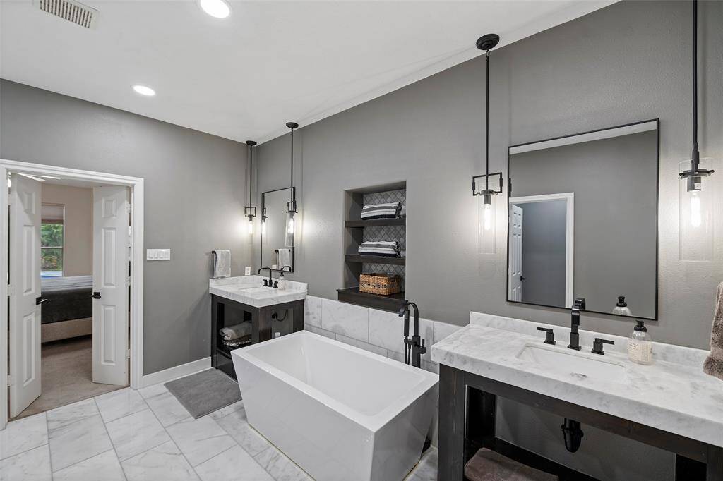 Remodeled primary bathroom with soaker tub.