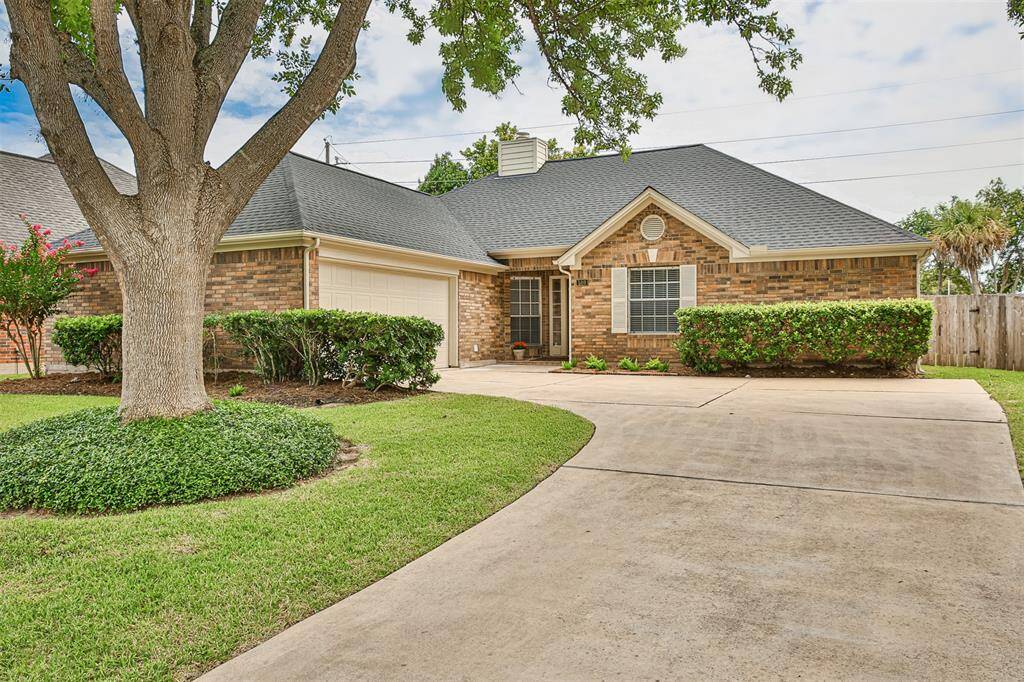 The one-year old roof and immaculate landscaping create special curb appeal.