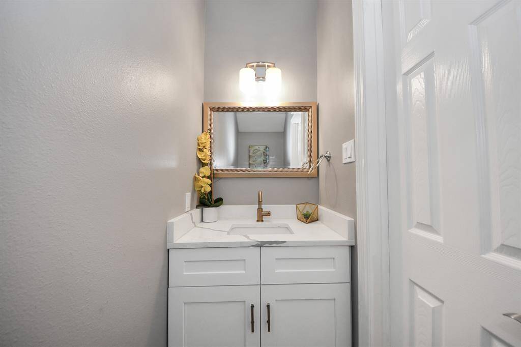 Powder room downstairs provides convenience for the first floor of the home.