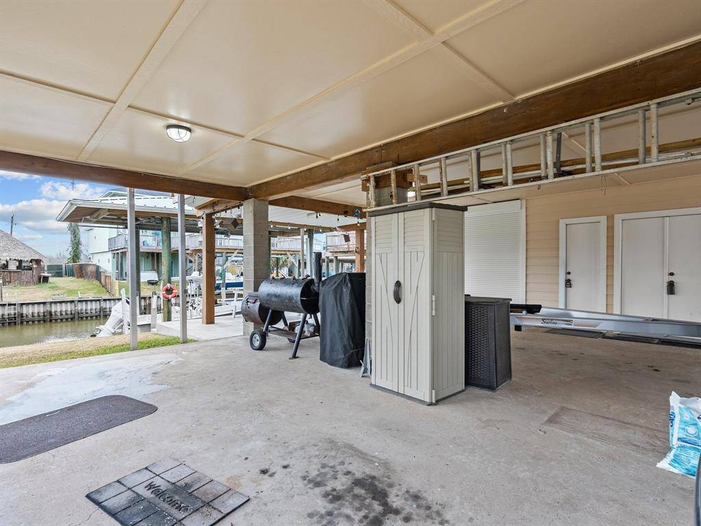 Area under house has garage for golf cart, 3rd full bath for cleaning up before entering the house and storage closets.