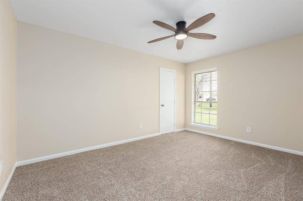 Spacious third bedroom featuring a convenient walk-in closet.