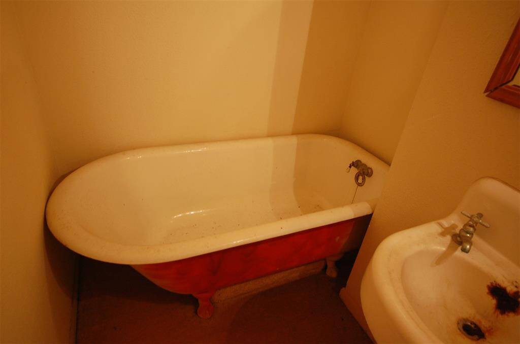 2nd bathroom with antique clawfoot tub.