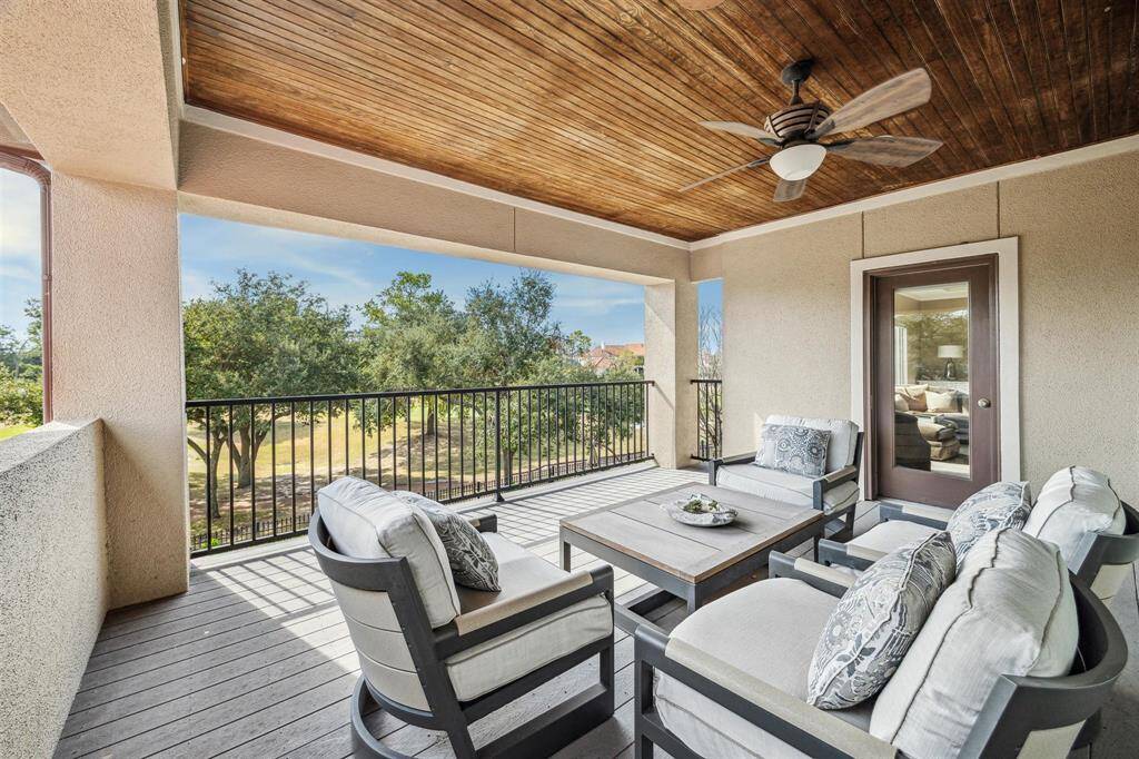 This exceptional second floor outdoor living space affords sweeping golf course and backyard retreat views.