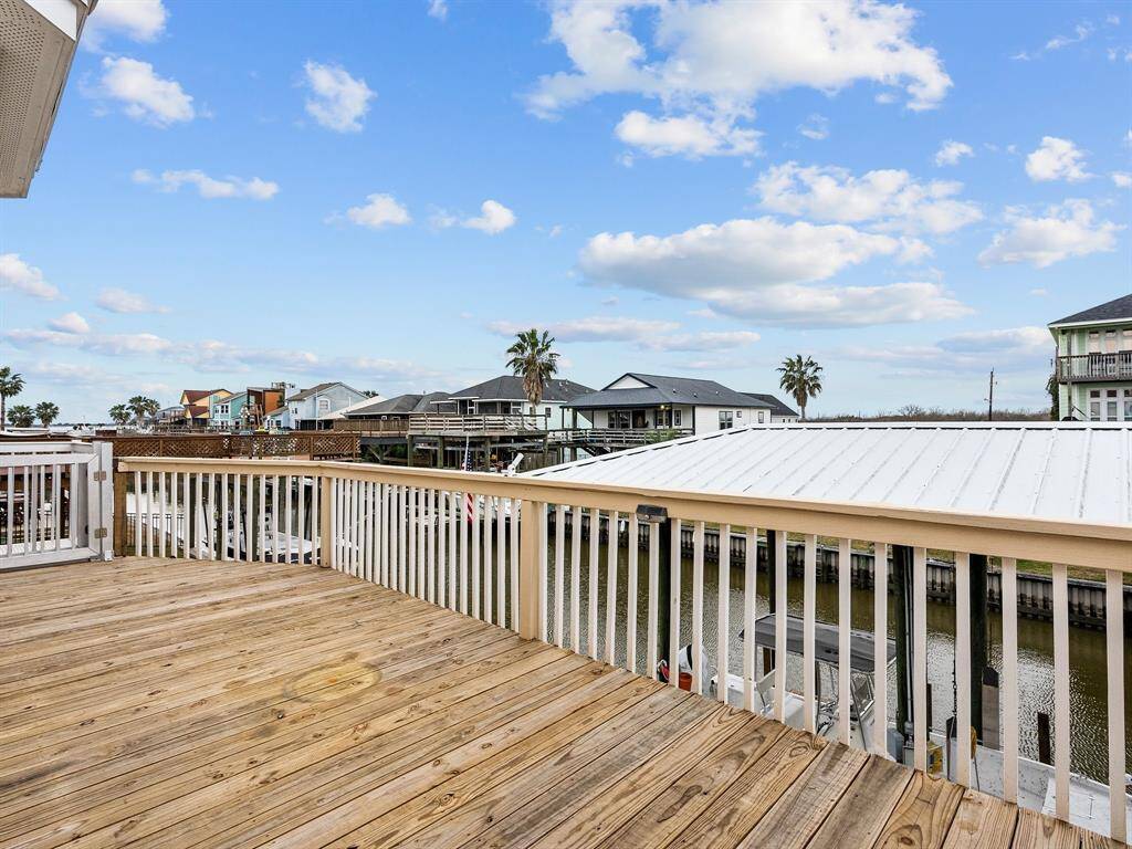Deck off of the kitchen has views of the canal and the bay. Just a great place to soak up the sun! Cargo lift at the end of the porch to carry groceries or anything up or down.