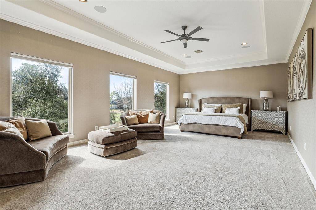 The second floor primary bedroom option is perfect for a multi-generational household and offers lovely natural light, sweeping golf course views and access to the covered outdoor living space