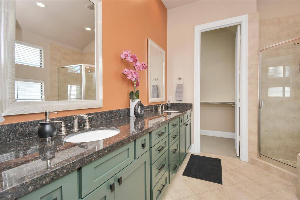 Huge master bath with dual sinks, door is to the huge master closet